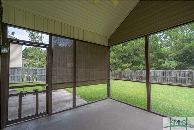 unfurnished sunroom featuring lofted ceiling