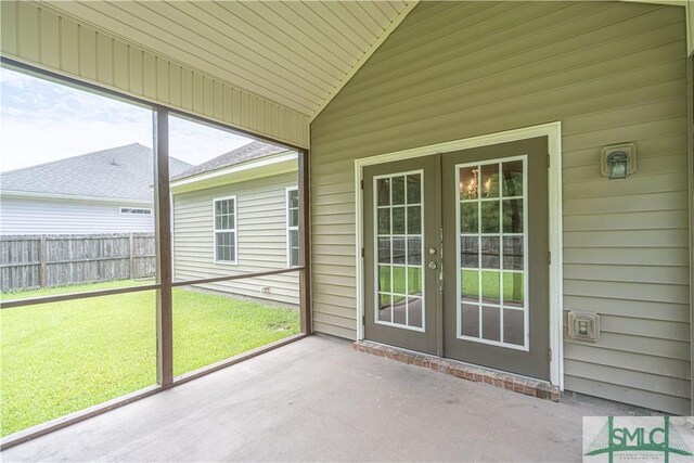 unfurnished sunroom featuring french doors