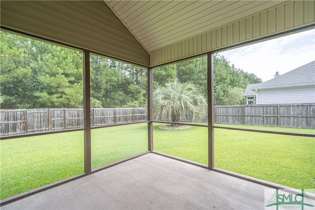 unfurnished sunroom with lofted ceiling