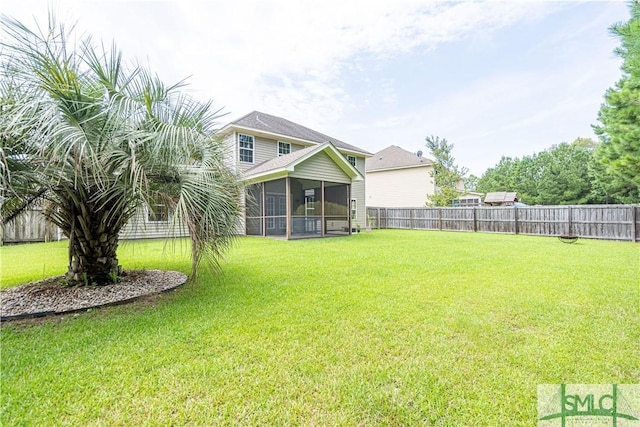 exterior space with a sunroom and a fenced backyard