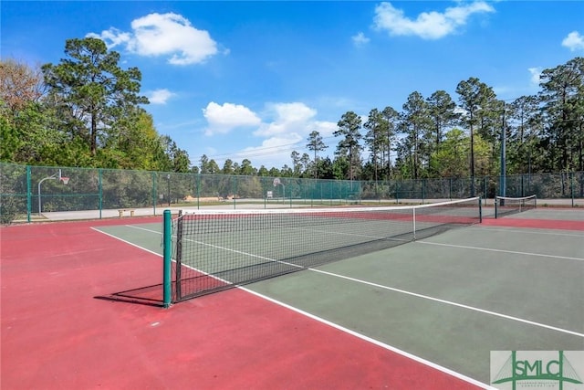 view of sport court with fence