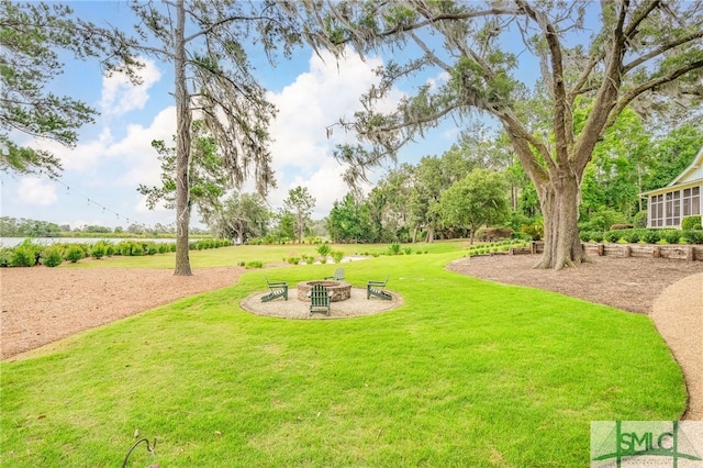 1654 Dublin Dr, Richmond Hill, GA 31324 - view of yard featuring an outdoor fire pit