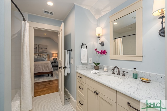 bathroom featuring vanity, a shower with shower curtain, and hardwood / wood-style floors