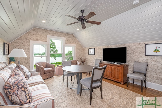 living room with light hardwood / wood-style floors, wooden ceiling, vaulted ceiling, and ceiling fan