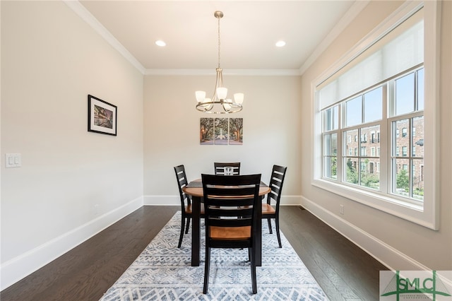 dining space with a notable chandelier, dark hardwood / wood-style flooring, and crown molding