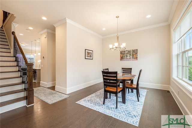 dining space with crown molding, dark hardwood / wood-style flooring, and a notable chandelier