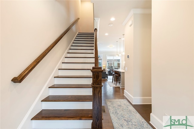 staircase with wood-type flooring