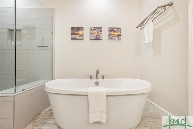 bathroom featuring separate shower and tub and tile patterned floors