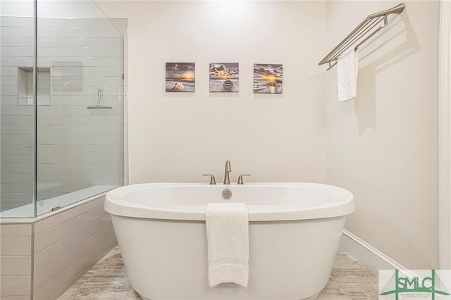 453 Port St, Savannah, GA 31401 - bathroom featuring a tile shower and a freestanding tub