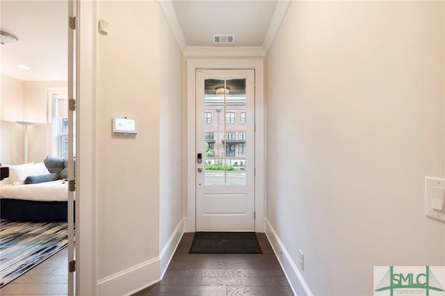 453 Port St, Savannah, GA 31401 - doorway with crown molding and dark wood-style floors