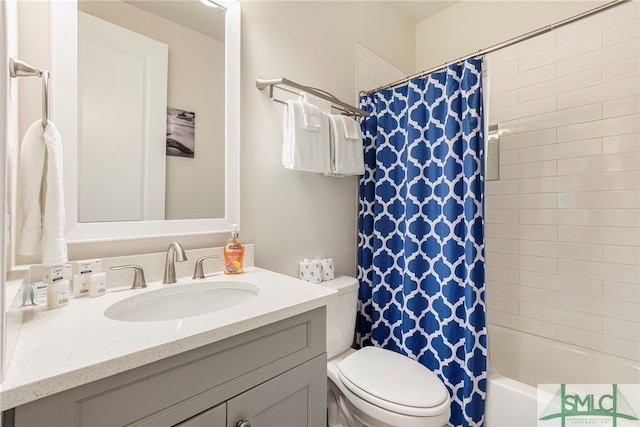 full bathroom with vanity, toilet, and shower / bath combo with shower curtain