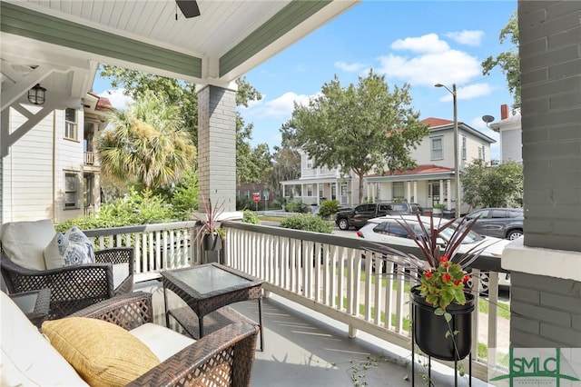 balcony with ceiling fan and covered porch