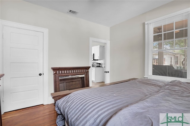 bedroom with wood-type flooring