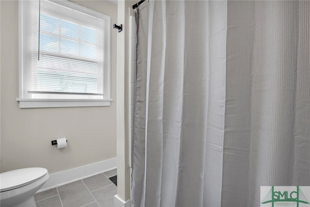 bathroom featuring tile patterned floors and toilet