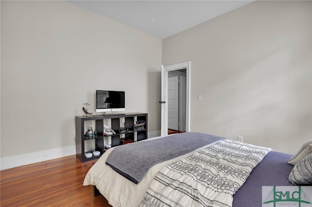 bedroom with hardwood / wood-style floors