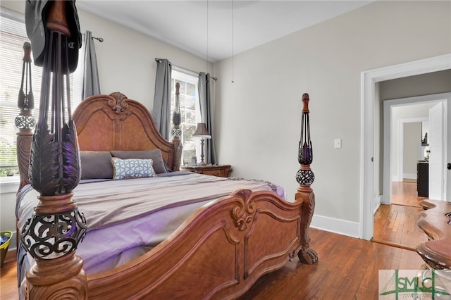 bedroom with hardwood / wood-style floors