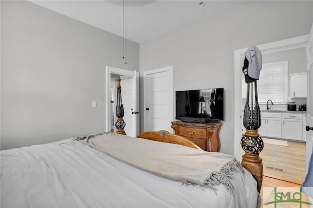 bedroom featuring hardwood / wood-style flooring