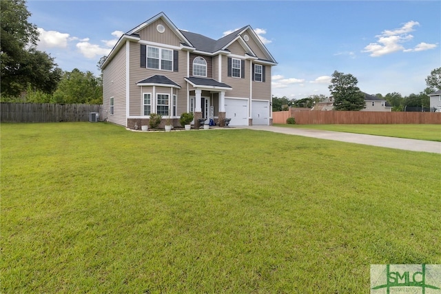 view of front of house with central AC unit, a front yard, and a garage