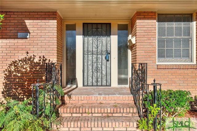 view of exterior entry featuring a porch