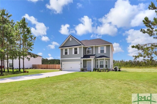 view of front of house featuring a garage and a front yard