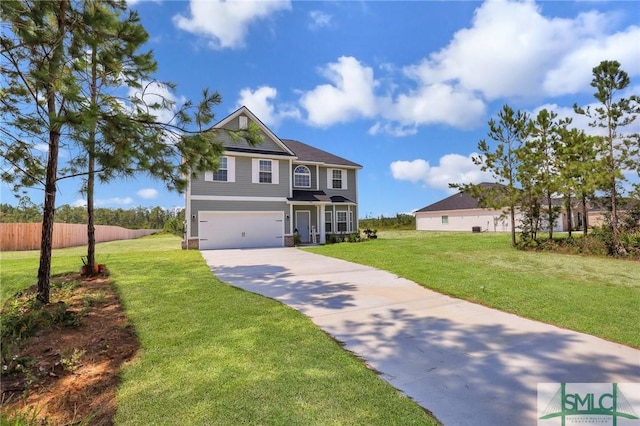 view of front of property featuring driveway, an attached garage, fence, and a front yard