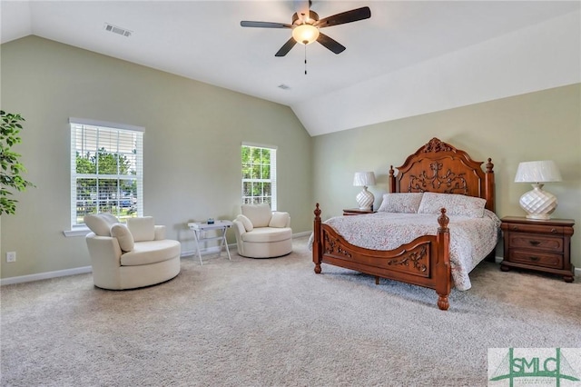 bedroom with lofted ceiling, carpet, and baseboards