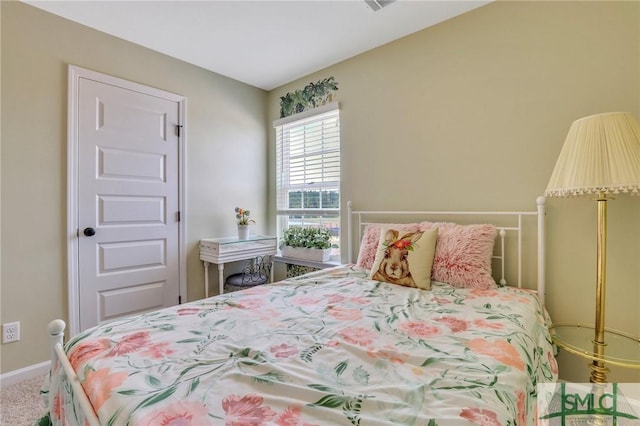 bedroom featuring carpet floors and baseboards