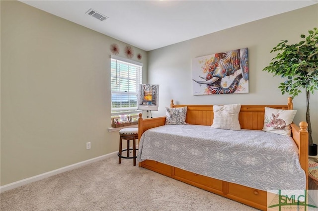 bedroom featuring baseboards, visible vents, and carpet flooring