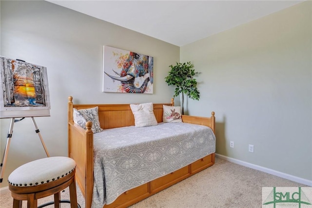 carpeted bedroom with baseboards