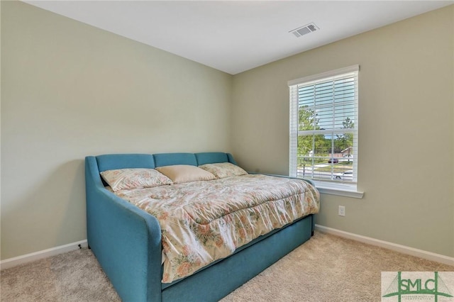 bedroom featuring carpet, visible vents, and baseboards