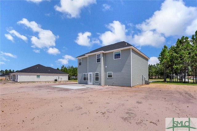 back of property featuring a patio