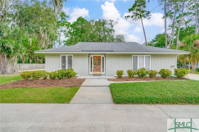 ranch-style home with a front yard