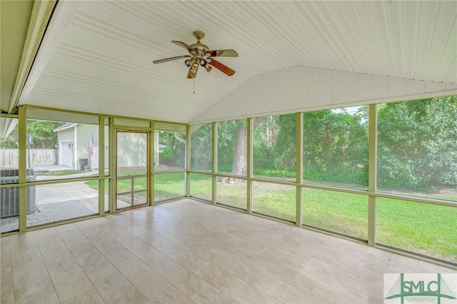 unfurnished sunroom with ceiling fan, lofted ceiling, and a wealth of natural light