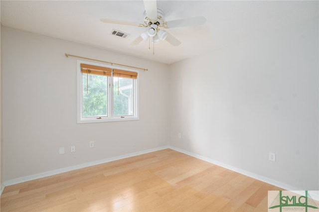 empty room featuring ceiling fan and light hardwood / wood-style flooring