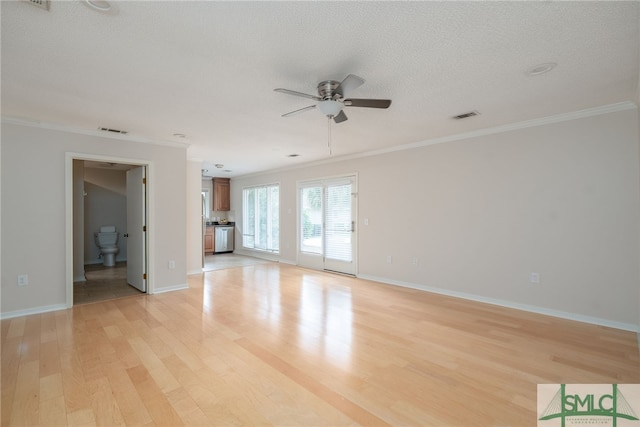 unfurnished living room featuring crown molding, ceiling fan, a textured ceiling, and light wood-type flooring