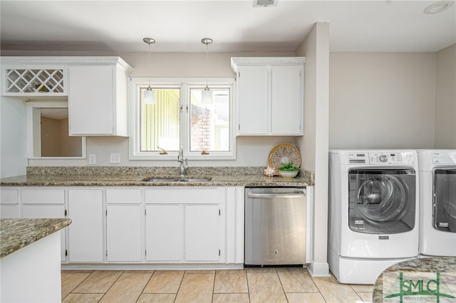 laundry room with independent washer and dryer and sink