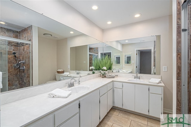 bathroom with a shower with door and vanity