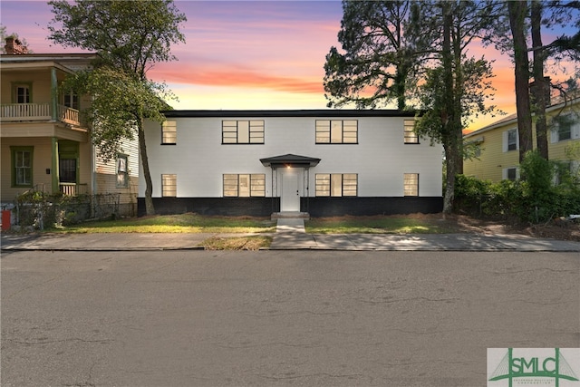 view of front of home with a balcony