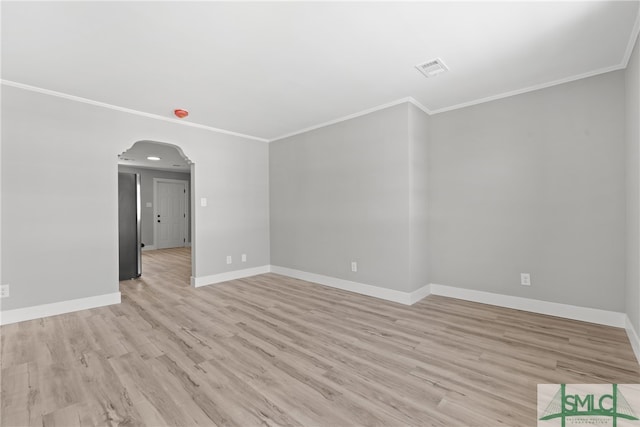 unfurnished room featuring light wood-type flooring and ornamental molding