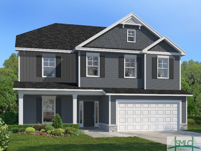 view of front of house featuring a garage and a front lawn