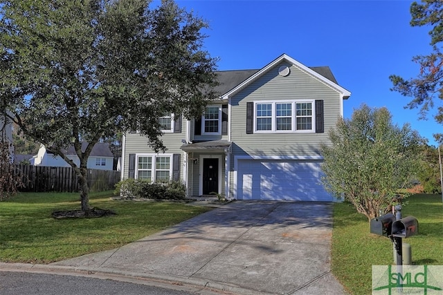 view of front of house featuring a front yard and a garage