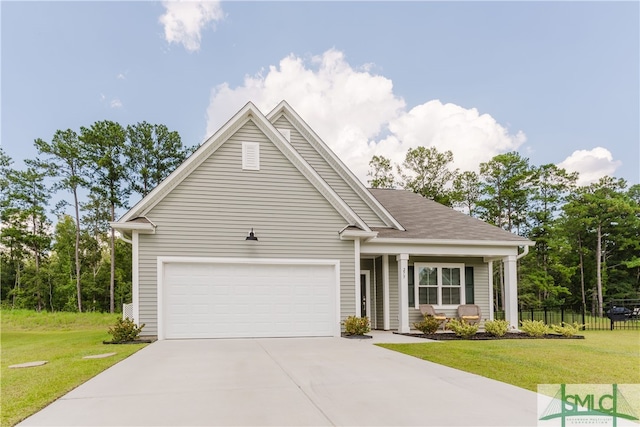 view of front of home featuring a front lawn and a garage