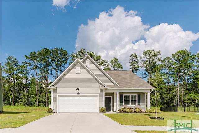 view of front facade with a front yard and a garage