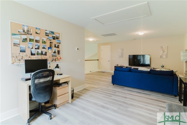 office space with light hardwood / wood-style flooring