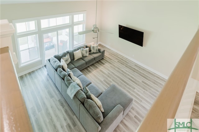 living room featuring a wealth of natural light and light wood-type flooring