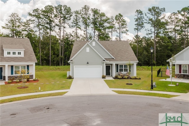 view of front of property with a garage and a front yard