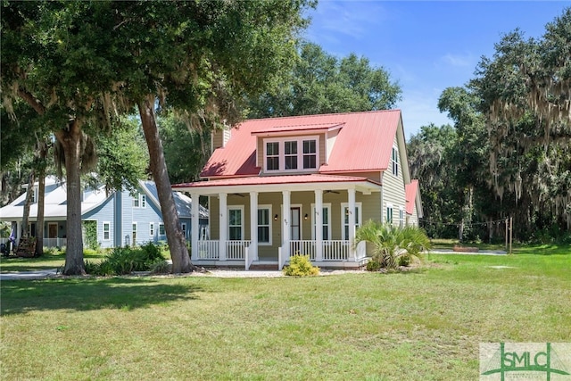 view of front of house with covered porch and a front lawn