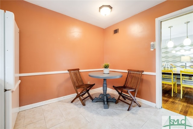 dining room with light hardwood / wood-style flooring