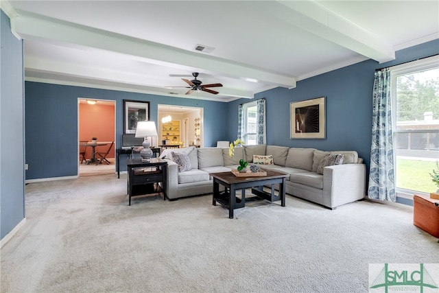 living room featuring carpet flooring, ceiling fan, beam ceiling, and ornamental molding