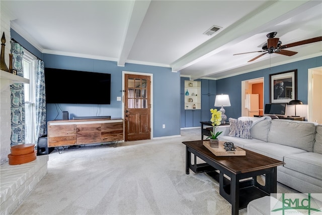 carpeted living room featuring ornamental molding, beam ceiling, and ceiling fan